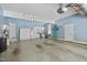 Spacious garage with ample storage, featuring built-in cabinets and room for multiple vehicles at 10523 Bedfordtown Dr, Raleigh, NC 27614