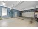 Functional garage space featuring ample storage and access to exterior, painted in pleasing neutral tones at 10523 Bedfordtown Dr, Raleigh, NC 27614