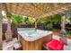 Relaxing hot tub with pergola offers a private spa experience in the backyard at 10523 Bedfordtown Dr, Raleigh, NC 27614
