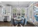 Charming eat-in kitchen with pendant lighting, hardwood floors and large windows providing lots of natural light at 10523 Bedfordtown Dr, Raleigh, NC 27614