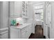 Transitional style kitchen with light cabinets, stone countertops, and an entry to the main kitchen at 10523 Bedfordtown Dr, Raleigh, NC 27614