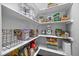 Walk-in pantry with an abundance of shelving and storage space at 10523 Bedfordtown Dr, Raleigh, NC 27614