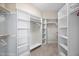 Spacious walk-in closet with built-in shelves and ample storage at 10523 Bedfordtown Dr, Raleigh, NC 27614