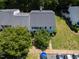 Aerial view of a well-maintained home surrounded by mature trees and greenery at 11 Providence Ct, Durham, NC 27705