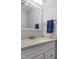 Bathroom featuring a white vanity, stone countertop, and a large mirror with a towel rack at 11 Providence Ct, Durham, NC 27705