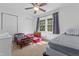 Spacious bedroom with natural light, multiple beds, and two closets at 11 Providence Ct, Durham, NC 27705