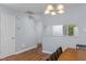 Cozy dining room with wood floors, view into kitchen, and a modern chandelier at 11 Providence Ct, Durham, NC 27705