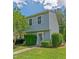 Charming two-story home with blue siding, white trim, and well-maintained landscaping in a desirable neighborhood at 11 Providence Ct, Durham, NC 27705