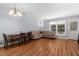 Cozy living room features a large sectional sofa, wood floors, and lots of natural light from large windows at 11 Providence Ct, Durham, NC 27705