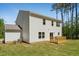 Exterior shot of a home, highlighting the deck and spacious backyard with lush green grass at 110 Cribbs Ln, Middlesex, NC 27557