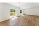 Bright and airy living area with hardwood floors and sliding glass doors to a deck at 110 Cribbs Ln, Middlesex, NC 27557