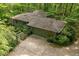 Aerial shot of a home surrounded by lush trees, showcasing privacy and natural beauty at 11009 Eaglerock Dr, Raleigh, NC 27613