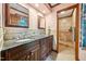 Bathroom with double sink vanity, granite countertop, tile backsplash, and glass-enclosed shower at 11009 Eaglerock Dr, Raleigh, NC 27613