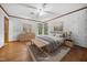 Relaxing bedroom features wood flooring, soothing paint colors, and complementary furnishings at 11009 Eaglerock Dr, Raleigh, NC 27613