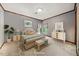 Serene bedroom features soft colors, textured wallpaper, and plenty of natural light at 11009 Eaglerock Dr, Raleigh, NC 27613