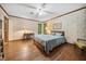 Serene bedroom featuring hardwood floors and a view of backyard at 11009 Eaglerock Dr, Raleigh, NC 27613