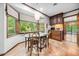 Sunlit dining area features a large window with lush green views and lovely dark wood trim at 11009 Eaglerock Dr, Raleigh, NC 27613