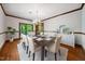 Elegant dining room featuring hardwood floors, a chandelier, and seating for eight at 11009 Eaglerock Dr, Raleigh, NC 27613