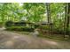 Secluded home surrounded by lush greenery, offering a private and tranquil setting at 11009 Eaglerock Dr, Raleigh, NC 27613
