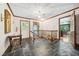 Spacious foyer with stone floors, wooden staircase, and natural light at 11009 Eaglerock Dr, Raleigh, NC 27613