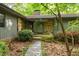 Charming stone and siding home with a stone walkway leading to the covered front entrance at 11009 Eaglerock Dr, Raleigh, NC 27613