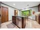 Gourmet kitchen with an island, stainless steel appliances, and a view of the backyard at 11009 Eaglerock Dr, Raleigh, NC 27613