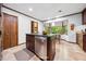 Gourmet kitchen island features bar seating, stainless steel appliances, and ample counter space at 11009 Eaglerock Dr, Raleigh, NC 27613
