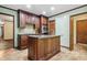 Modern kitchen with a large island, granite countertops and stainless steel appliances at 11009 Eaglerock Dr, Raleigh, NC 27613