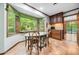 Bright eat-in kitchen with large windows offering scenic views of the backyard at 11009 Eaglerock Dr, Raleigh, NC 27613
