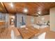 Relaxing living room showcasing a cozy fireplace and beautiful wood ceiling and floors at 11009 Eaglerock Dr, Raleigh, NC 27613