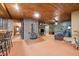 Cozy living room featuring a brick fireplace and rustic wood accents with bar seating at 11009 Eaglerock Dr, Raleigh, NC 27613