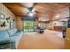 Relaxing living room with a fireplace, comfortable seating, and a scenic outdoor view at 11009 Eaglerock Dr, Raleigh, NC 27613