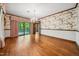 Spacious living room featuring hardwood floors and a sliding glass door leading to the deck at 11009 Eaglerock Dr, Raleigh, NC 27613