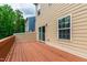 A spacious wood back deck with sliding glass door access offers great outdoor living space at 1101 Boxcar Way, Apex, NC 27502