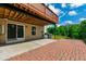 View of the paver patio, manicured lawn, and fenced perimeter at 1101 Boxcar Way, Apex, NC 27502