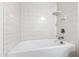 Bathroom features white tiled shower and tub, plus a corner shelf at 1101 Boxcar Way, Apex, NC 27502