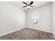 Bedroom featuring carpeted floor, and a window with blinds for natural light at 1101 Boxcar Way, Apex, NC 27502