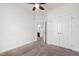 Bedroom featuring carpeted floor, ceiling fan, and adjacent bathroom at 1101 Boxcar Way, Apex, NC 27502