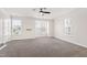 Large bonus room with neutral carpet and windows that provide natural light at 1101 Boxcar Way, Apex, NC 27502
