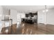 Spacious open living area with kitchen, stainless appliances and plentiful light at 1101 Boxcar Way, Apex, NC 27502