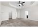 Spacious primary suite with neutral carpet, ample closet space, and ensuite bathroom at 1101 Boxcar Way, Apex, NC 27502