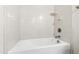 Bathroom shower featuring white tiling, a shower head, and a faucet at 1101 Boxcar Way, Apex, NC 27502