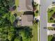 Overhead view of a home featuring a landscaped backyard with an outdoor patio area and neighboring houses at 1103 Capstone Dr, Durham, NC 27713