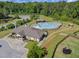Community clubhouse with a sparkling pool, playground, and meticulously maintained green spaces at 1103 Capstone Dr, Durham, NC 27713