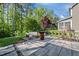 Beautiful backyard with patio area, outdoor seating, and lush greenery surrounding the perfect entertainment spot at 1103 Capstone Dr, Durham, NC 27713