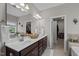 Bathroom with double vanity sinks, granite countertops, and walk-in closet at 1103 Capstone Dr, Durham, NC 27713