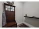 Cozy entryway featuring a dark wood hall tree with bench and storage at 1103 Capstone Dr, Durham, NC 27713