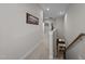 Upstairs hallway with carpet flooring looking down to the kitchen and living area at 1103 Capstone Dr, Durham, NC 27713