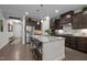 Modern kitchen with stainless steel appliances and a center island with barstool seating at 1103 Capstone Dr, Durham, NC 27713