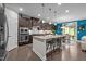 Modern kitchen featuring dark wood cabinets, granite counters, and stainless steel appliances at 1103 Capstone Dr, Durham, NC 27713